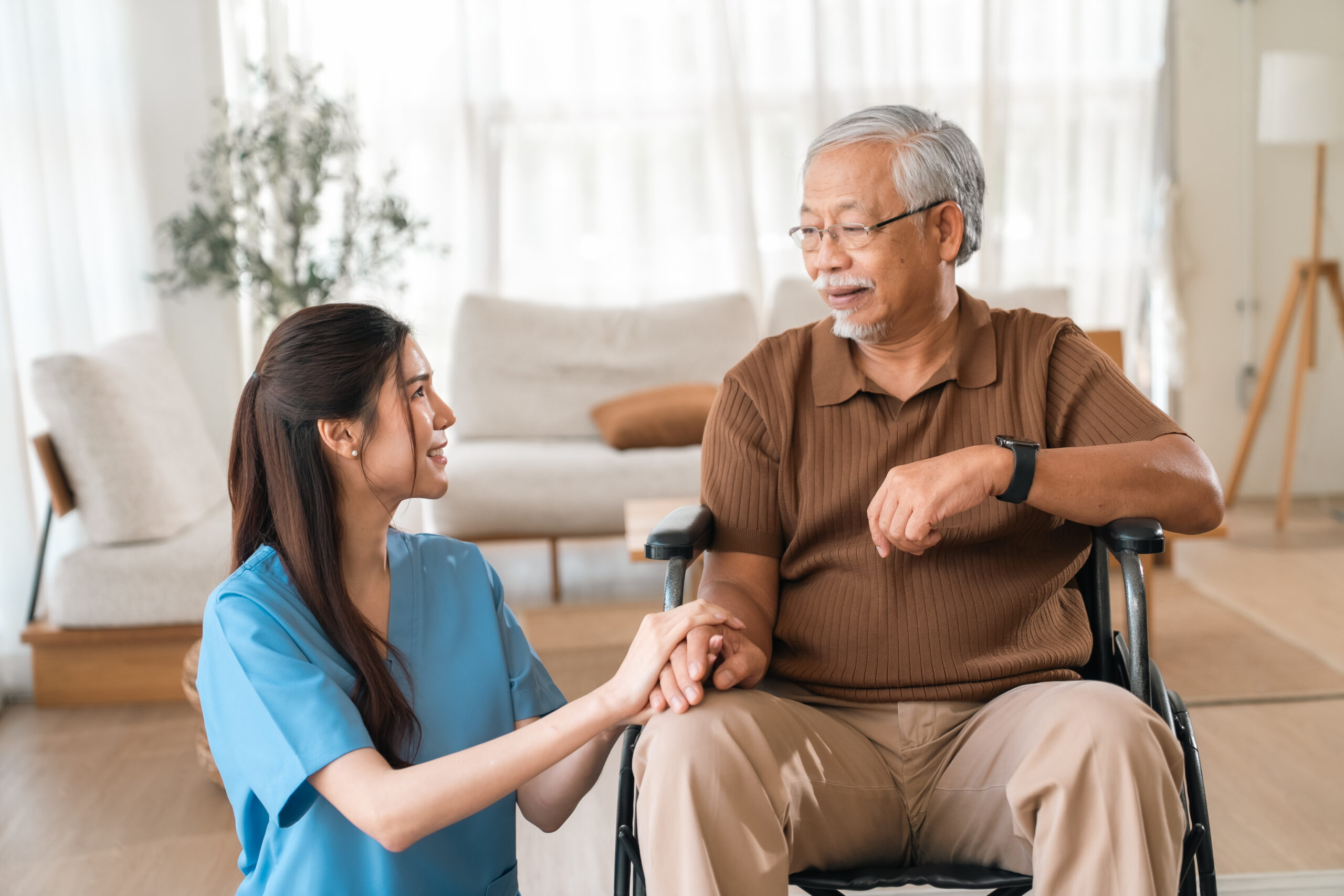 Home help service agency Meridian caregiver assisting an elderly adult at home
