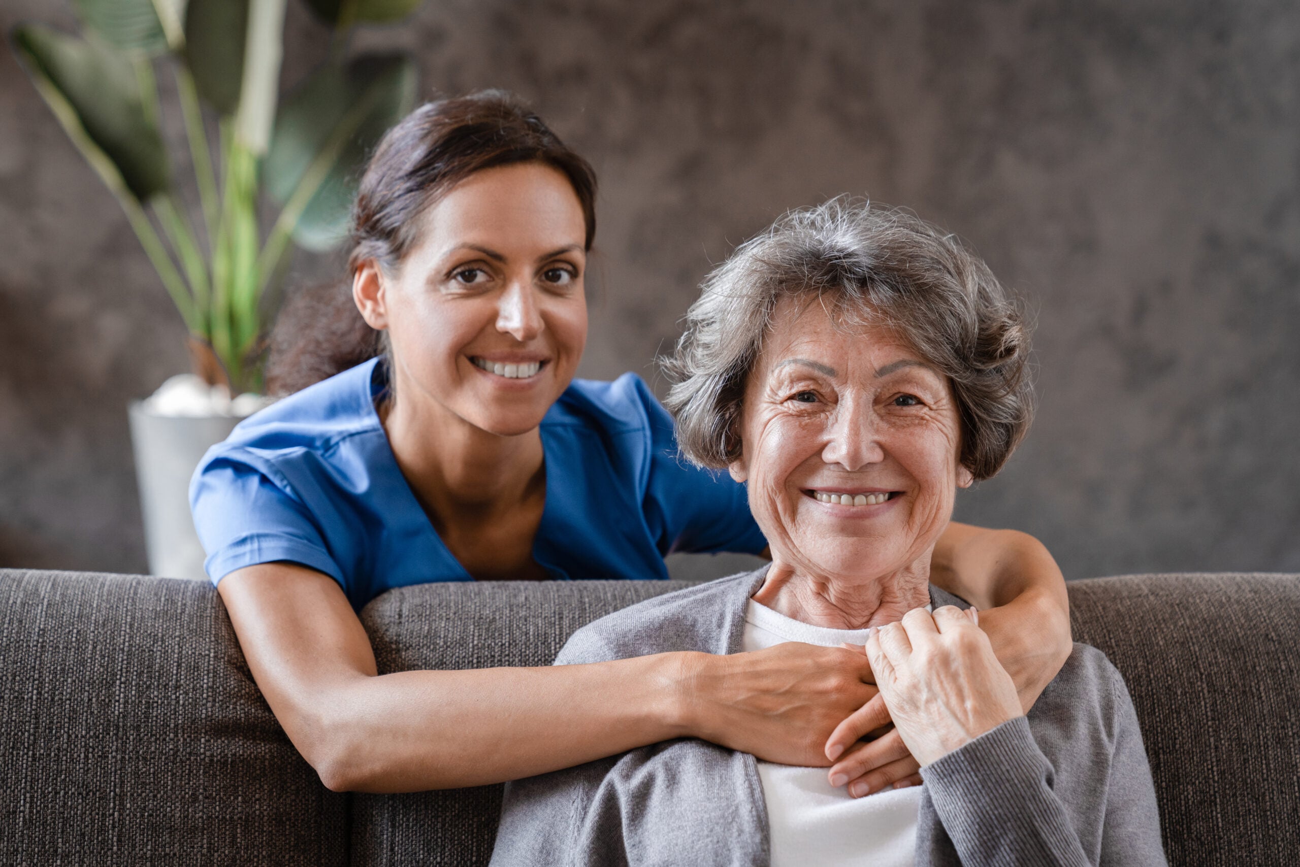 Home help care agency Middleton caregiver providing compassionate personal care and companionship to an aging senior at home.